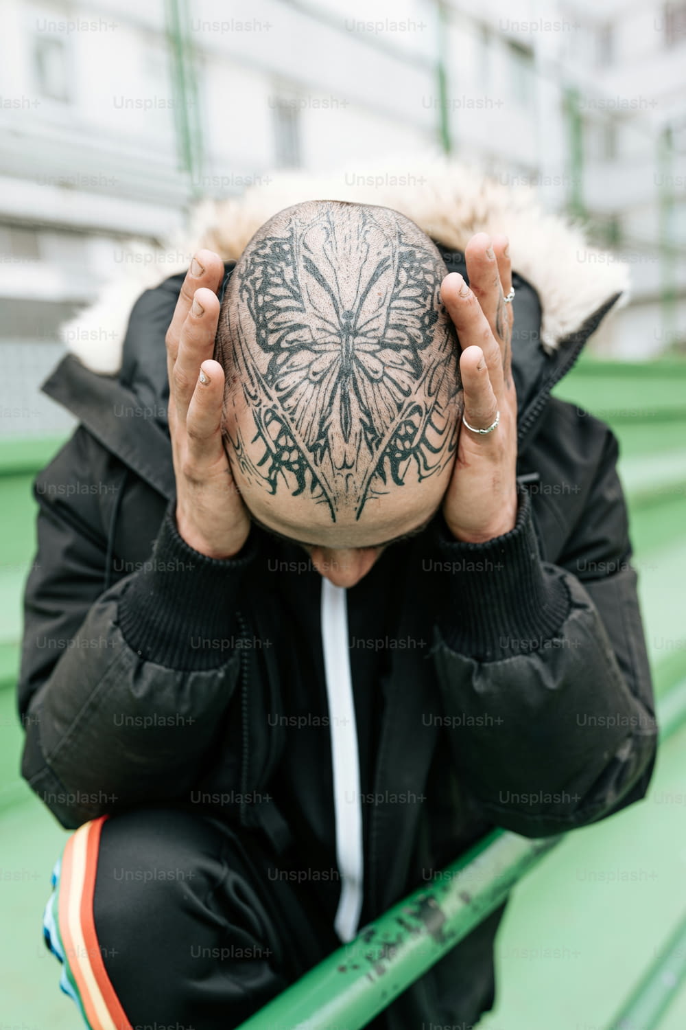 a person with a tattoo covering their face