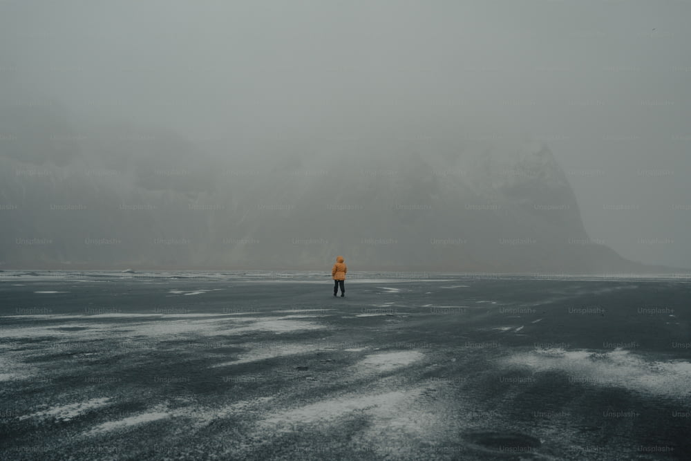 a person standing in the middle of a large body of water