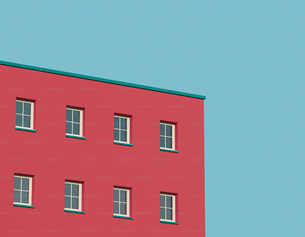 a red building with a blue sky in the background