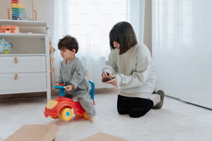 a woman playing with a child in a room