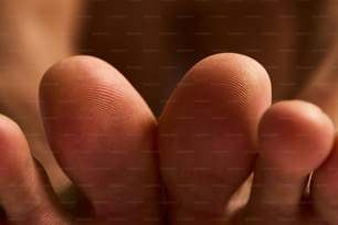 a close up of a person's fingers with a blurry background
