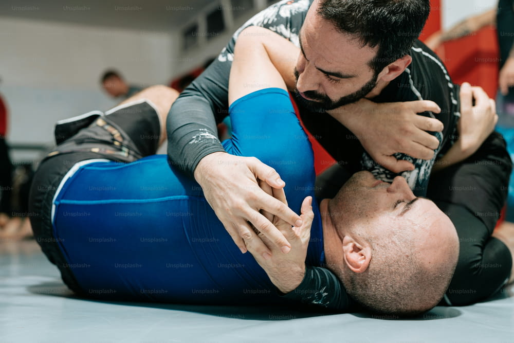 a man wrestling another man in a wrestling ring