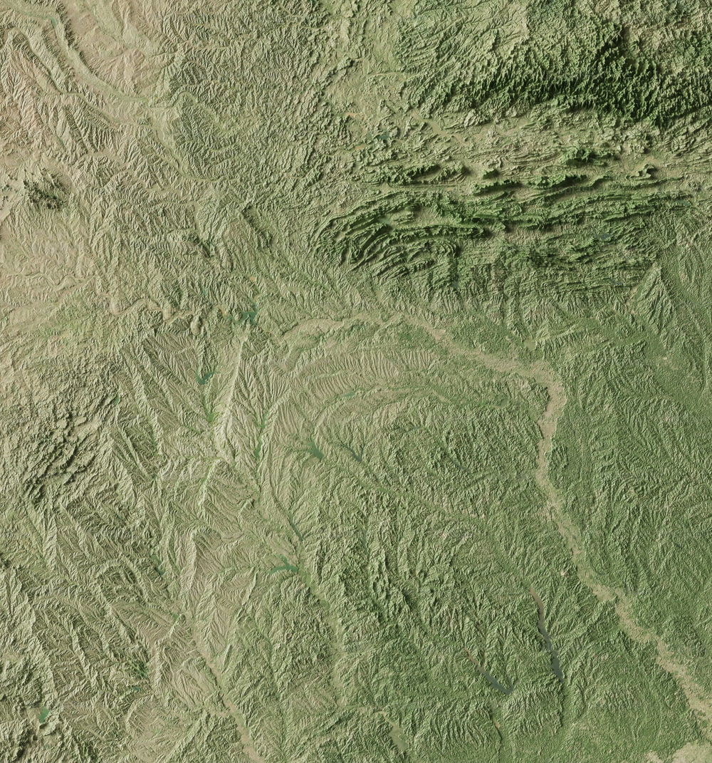 a satellite image of a green mountain range