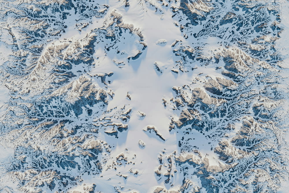an aerial view of a snow covered mountain
