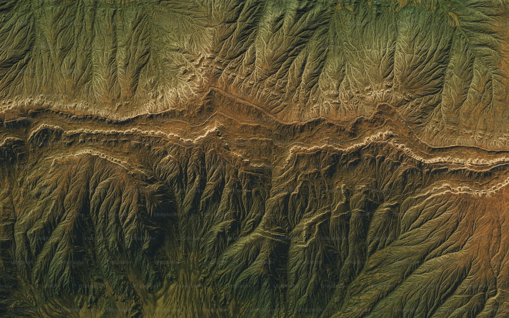 an aerial view of the terrain of a mountain range