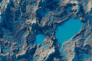 an aerial view of a blue lake surrounded by mountains