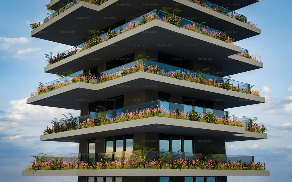 a tall building with balconies and flowers on the balconies