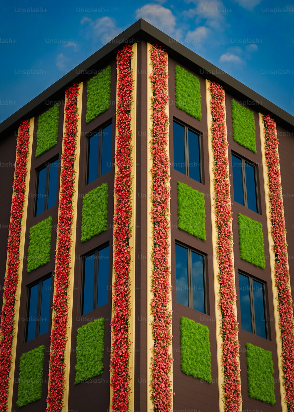 a tall building with many windows covered in green and red leaves