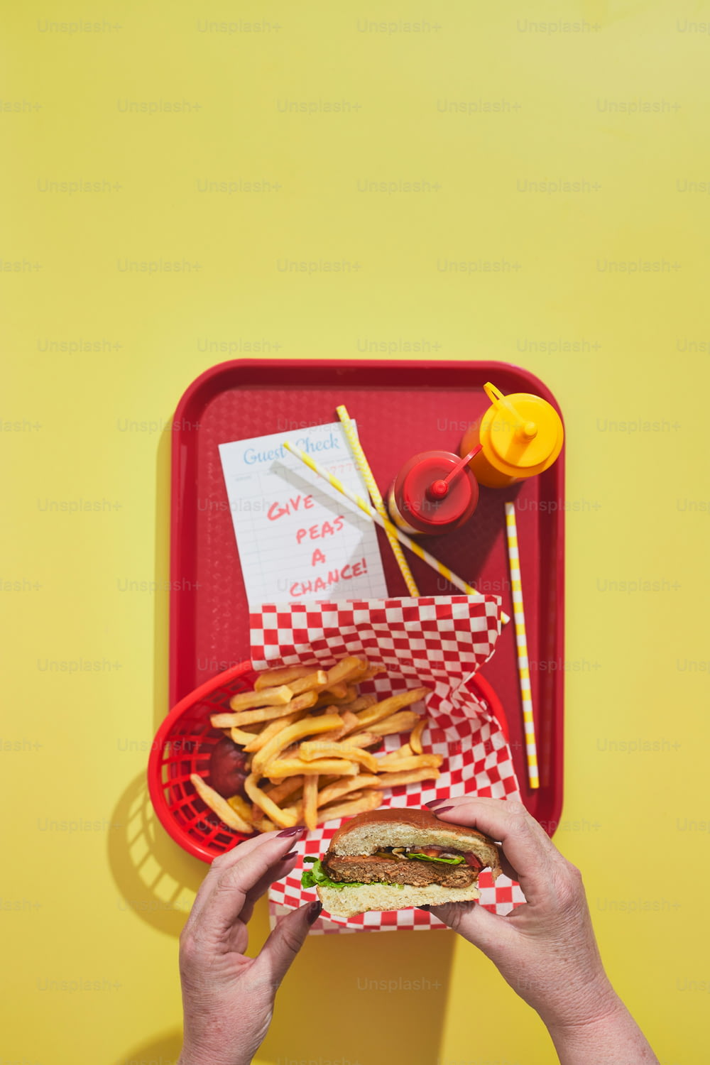 a tray with a sandwich and fries on it